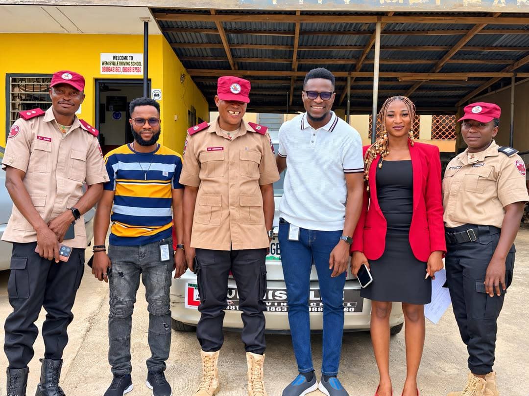 Wemisville representatives standing with FRSC officials at the driving school.